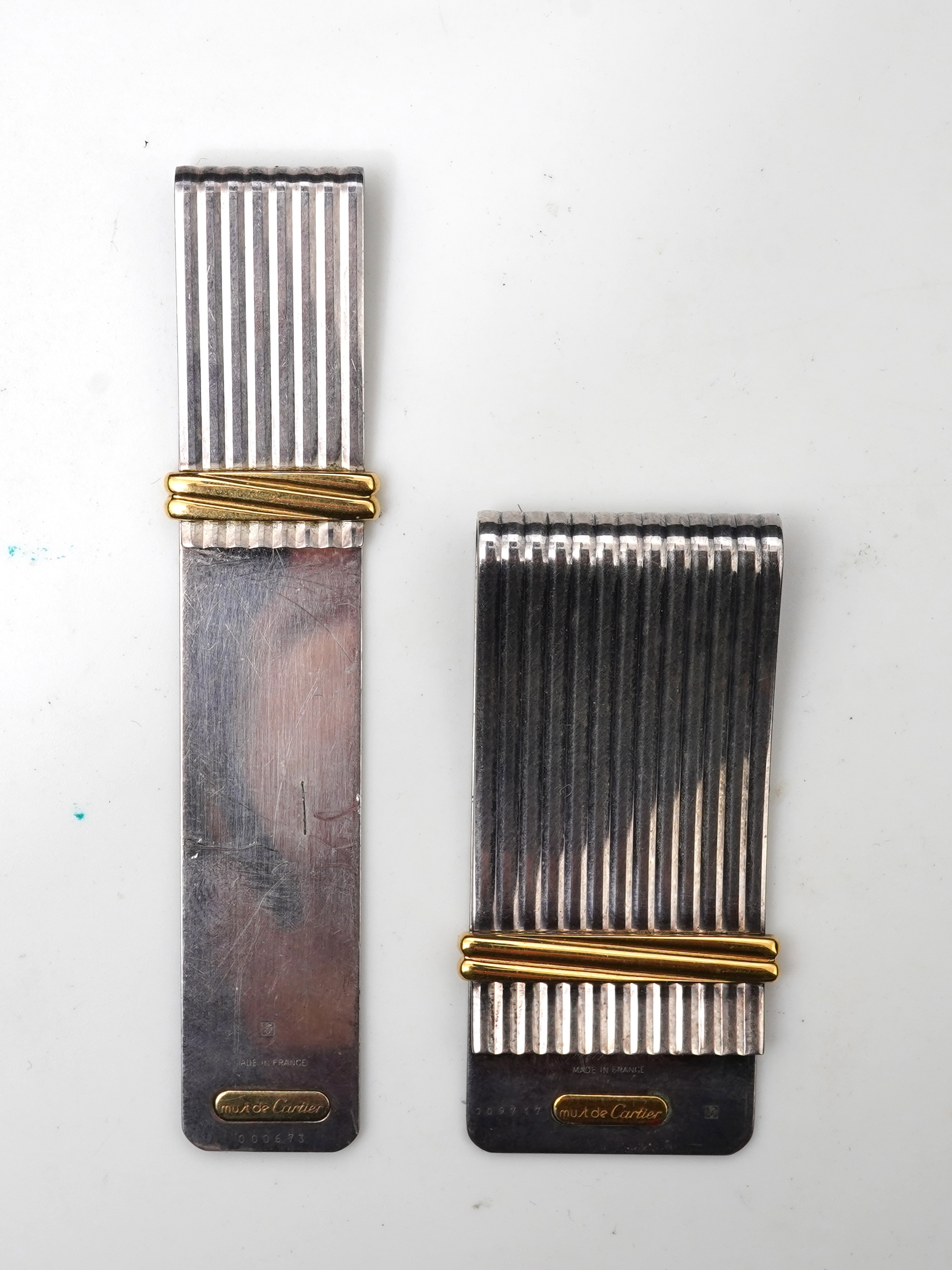 Cartier, two 'Must de Cartier' money clips